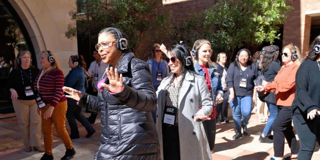 AEP Conference attendees dancing with headphones on that say "Be You."